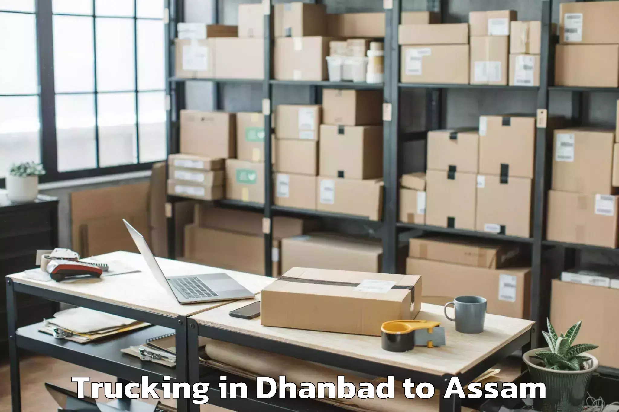 Book Dhanbad to Goshaingaon Trucking Online